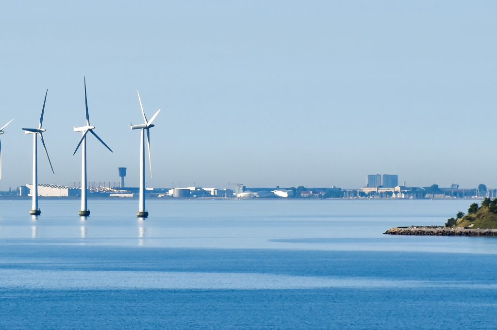 Environmental Toxicology Consulting from Nautilus Environmental displaying Offshore wind turbines on the coast of Copenhagen in Denmark with the airport in the background.